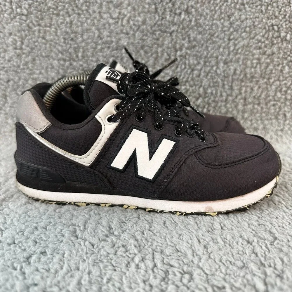 New Balance 574 size 2 kids youth black grey shoes